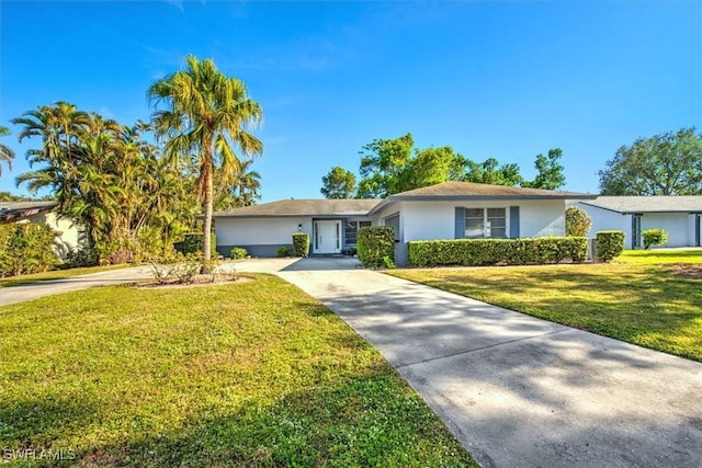 ranch-style house with a front lawn