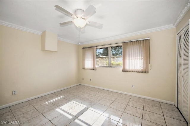 unfurnished bedroom featuring crown molding, a closet, ceiling fan, and light tile patterned floors