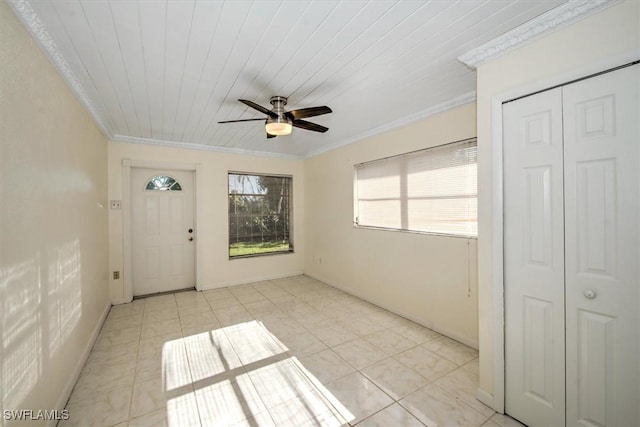 interior space featuring light tile patterned floors, ceiling fan, ornamental molding, and wood ceiling