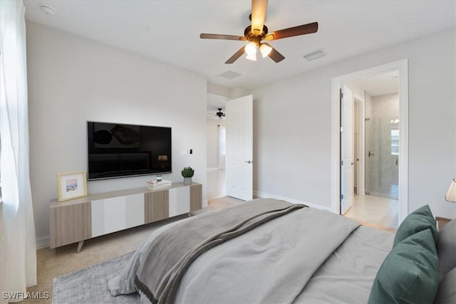 bedroom with ceiling fan and connected bathroom