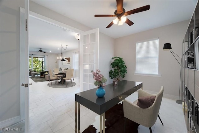 office area with french doors, ceiling fan, and light tile patterned flooring