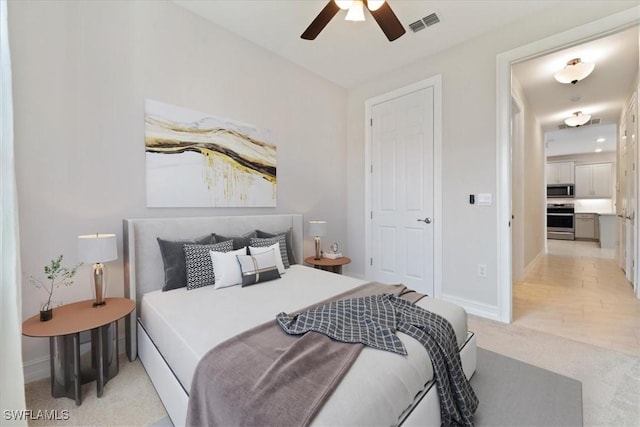 bedroom with light colored carpet and ceiling fan