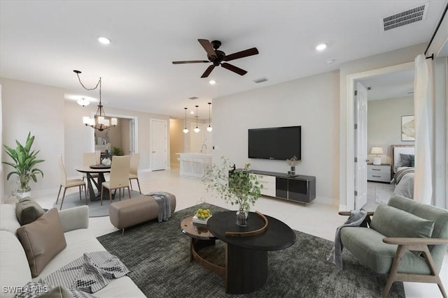 living room featuring ceiling fan with notable chandelier