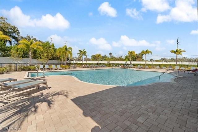 view of swimming pool with a patio