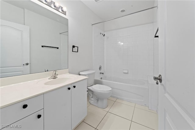 full bathroom with tile patterned floors, toilet, vanity, and tiled shower / bath