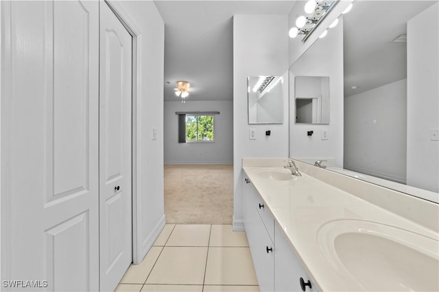 bathroom featuring tile patterned flooring and vanity