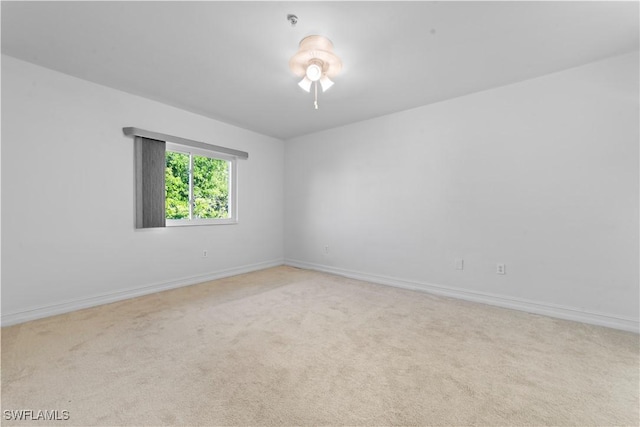 empty room featuring light colored carpet