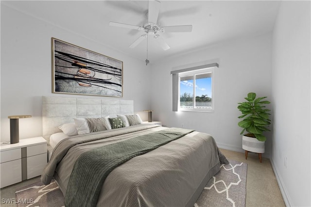 bedroom featuring ceiling fan and light colored carpet