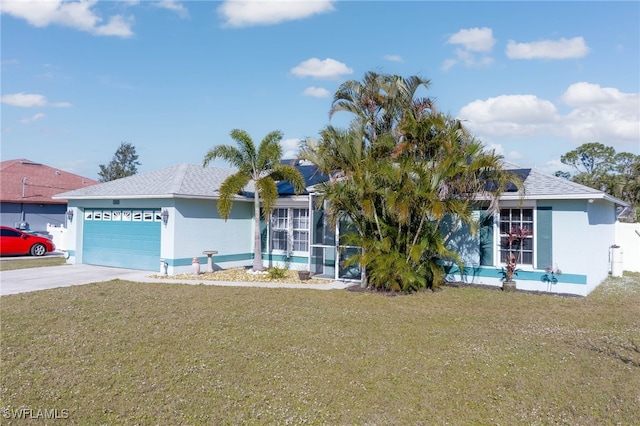 view of front of home featuring a garage and a front yard