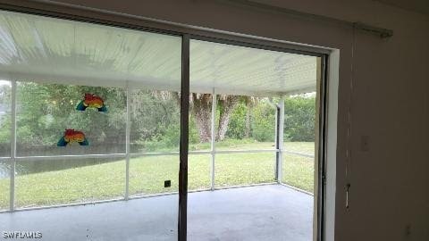 doorway to outside featuring concrete floors