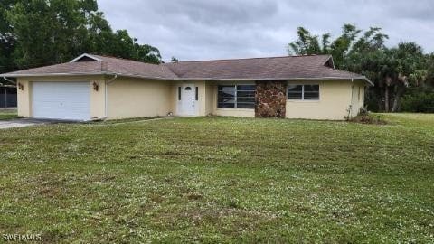 ranch-style house with a front lawn and a garage