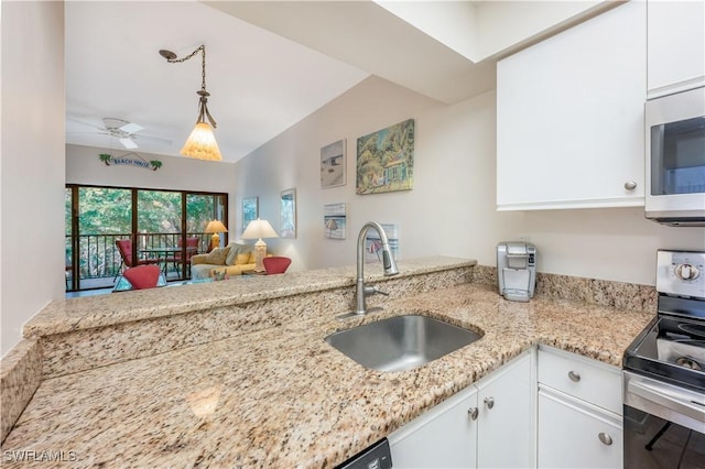 kitchen with ceiling fan, sink, light stone counters, stainless steel electric stove, and white cabinets