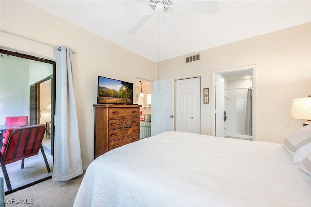 bedroom featuring light tile patterned floors, ensuite bathroom, and ceiling fan