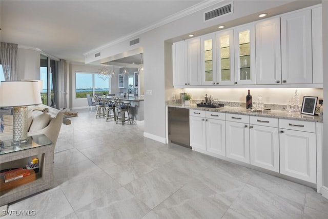 4800 Pelican Colony Blvd Unit 703, Bonita Springs, FL 34134 - kitchen featuring ornamental molding, light stone countertops, white cabinets, glass insert cabinets, and a chandelier