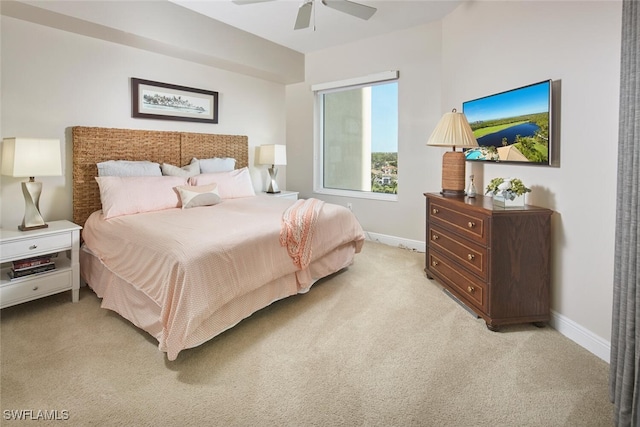 bedroom featuring ceiling fan and light colored carpet