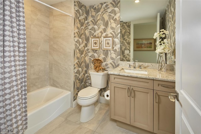 full bathroom with tile patterned floors, tiled shower / bath combo, toilet, and vanity