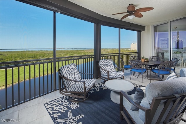 sunroom / solarium with ceiling fan