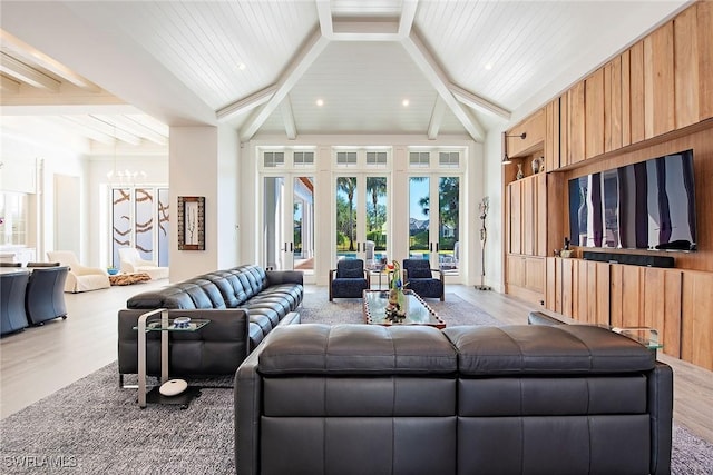 living room featuring beam ceiling, french doors, high vaulted ceiling, and light wood-type flooring