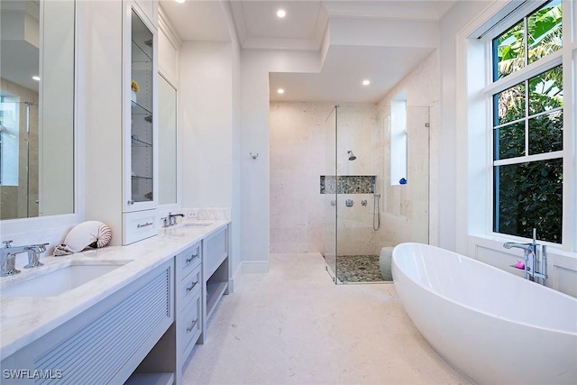 bathroom with vanity and independent shower and bath