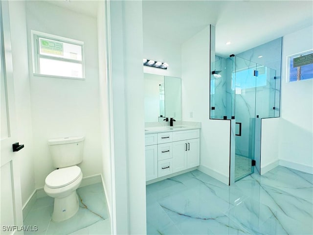 bathroom featuring vanity, toilet, and walk in shower