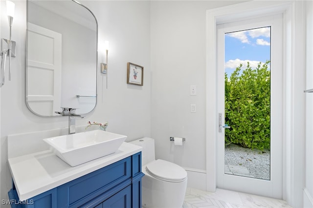 bathroom featuring vanity and toilet