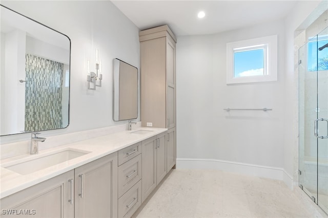 bathroom featuring vanity and a shower with shower door