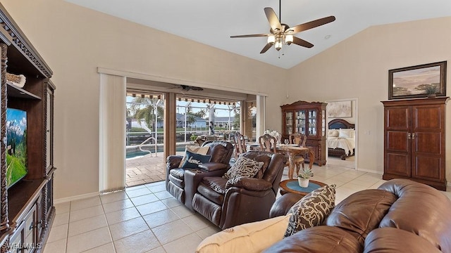 living room featuring light tile patterned floors, ceiling fan, and lofted ceiling