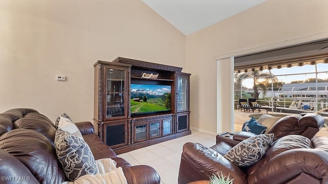 living room featuring light tile patterned flooring and high vaulted ceiling