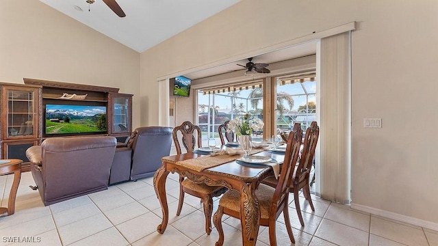 4212 SE 8th Pl, Cape Coral, FL 33904 - dining room with a ceiling fan, light tile patterned flooring, baseboards, and lofted ceiling