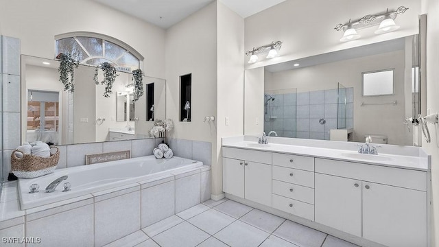 4212 SE 8th Pl, Cape Coral, FL 33904 - ensuite bathroom featuring double vanity, a tile shower, tile patterned flooring, and a sink