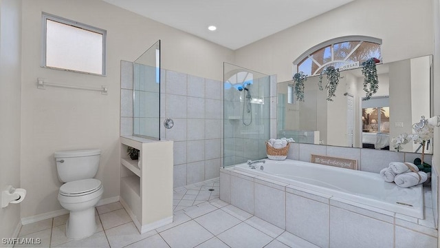 bathroom featuring tile patterned floors, separate shower and tub, and toilet