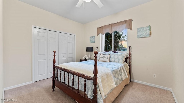 carpeted bedroom featuring a closet and ceiling fan