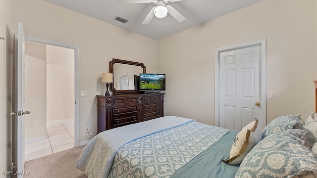 bedroom with light colored carpet and ceiling fan