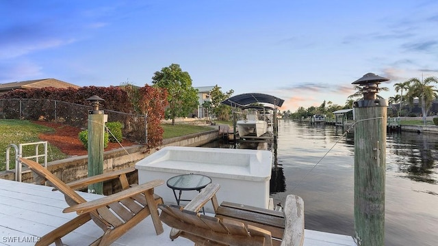 dock area with a water view