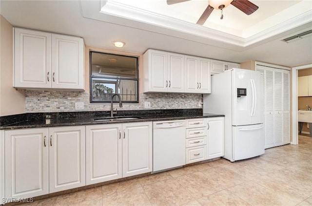 kitchen featuring white cabinetry, sink, and white appliances