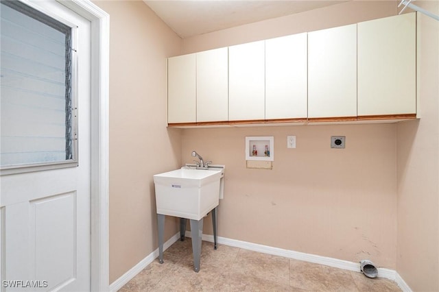 laundry area with hookup for an electric dryer, cabinets, and washer hookup