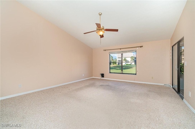 carpeted empty room with vaulted ceiling and ceiling fan