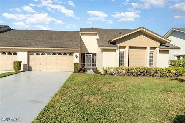 view of front of home with a garage and a front lawn