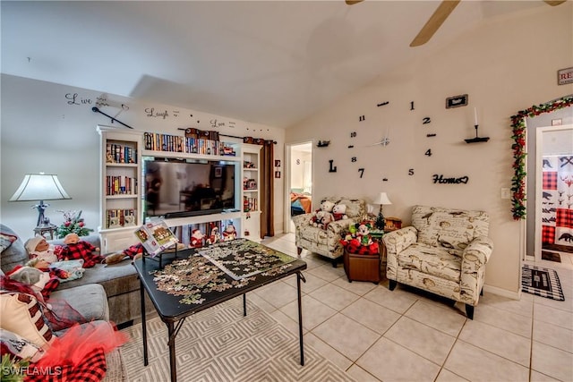 living room with ceiling fan, light tile patterned flooring, and vaulted ceiling