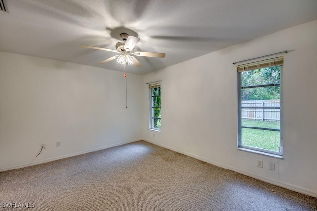 carpeted empty room with ceiling fan