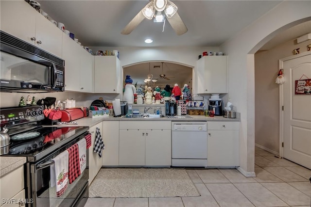 kitchen with white dishwasher, electric stove, ceiling fan, light tile patterned floors, and white cabinetry