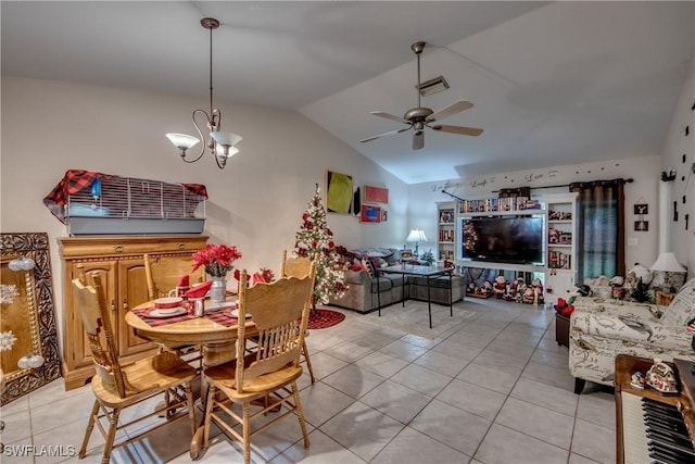 tiled dining room with ceiling fan with notable chandelier and vaulted ceiling