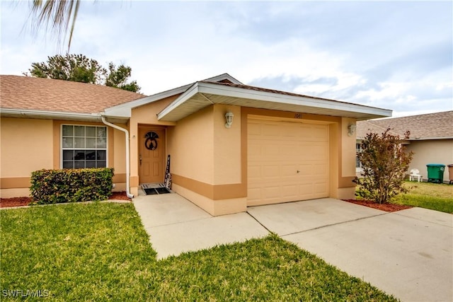 single story home featuring a garage and a front lawn