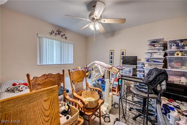 home office with ceiling fan and carpet floors