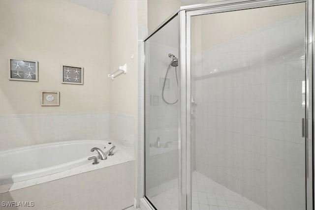 bathroom with separate shower and tub