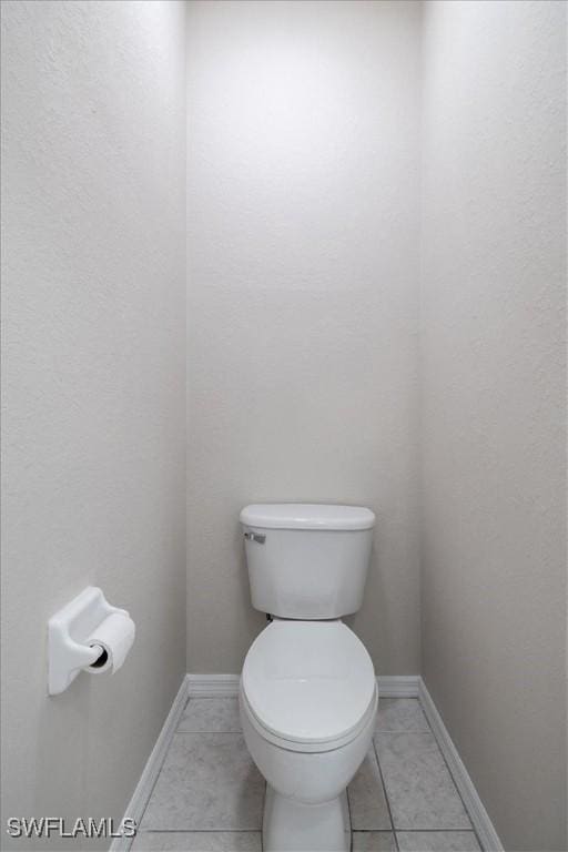 bathroom featuring tile patterned flooring and toilet