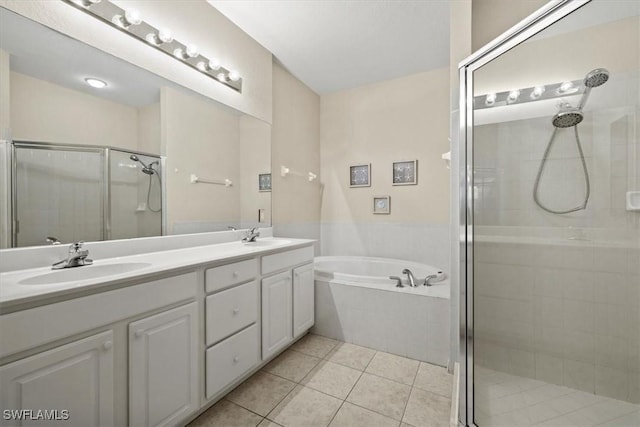 bathroom with independent shower and bath, vanity, and tile patterned floors