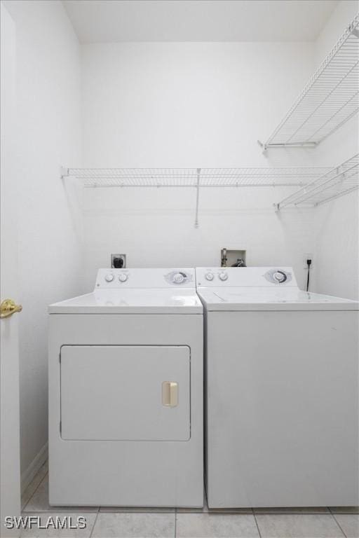 laundry room featuring washing machine and clothes dryer