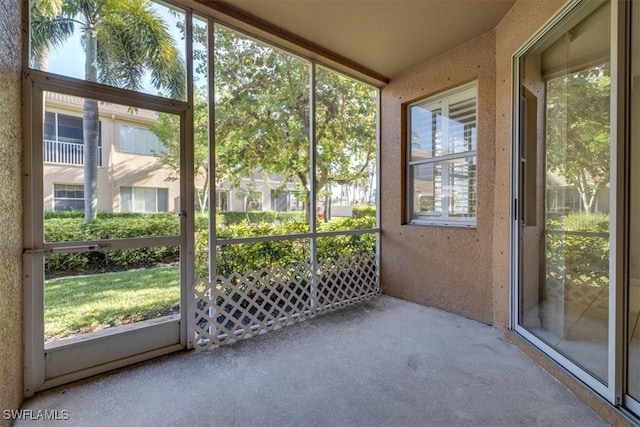 unfurnished sunroom with a wealth of natural light