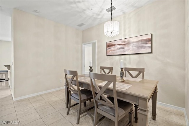 dining space featuring light tile patterned flooring